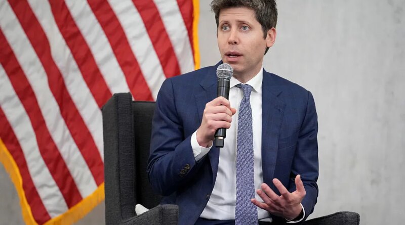 Sam Altman, CEO of OpenAI, sitting in front of American flag
