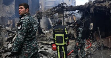 Rescuers stand at the site of an Israeli strike carried out on Wednesday, in Al-Mazraa in Beirut, Lebanon, April 9, 2026. REUTERS/Raghed Waked