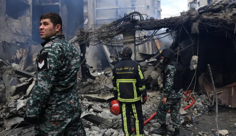 Rescuers stand at the site of an Israeli strike carried out on Wednesday, in Al-Mazraa in Beirut, Lebanon, April 9, 2026. REUTERS/Raghed Waked