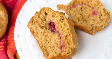 Peanut butter and jelly muffin on a white plate.