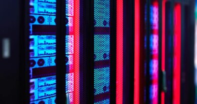 Servers glow in a data center rack.