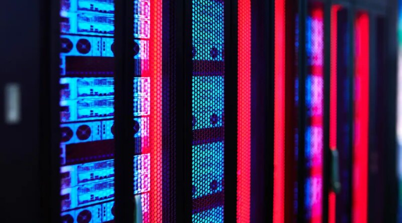 Servers glow in a data center rack.