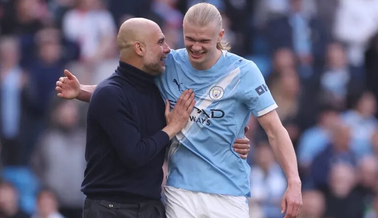MANCHESTER, ENGLAND - APRIL 19: Pep Guardiola, Manager of Manchester City, and Erling Haaland celebrate victory following the Premier League match between Manchester City and Arsenal at Etihad Stadium on April 19, 2026 in Manchester, England. (Photo by Carl Recine/Getty Images)
