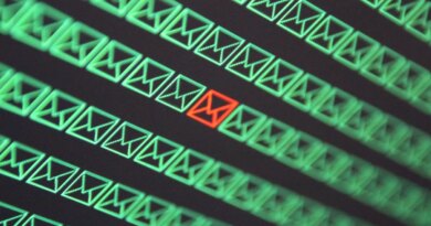 red email envelope in a sea of green email envelopes