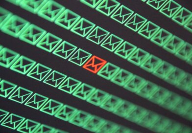 red email envelope in a sea of green email envelopes