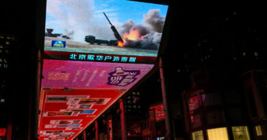 Taiwan sees only warships and warplanes as China talks peace with opposition