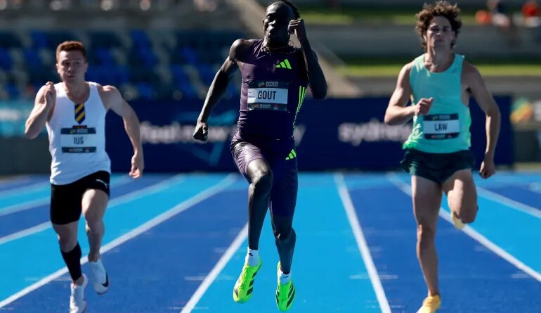 Australias Gout Gout (C) competes in the mens 200M final at the Australian Athletics Championships in Sydney on April 12, 2026. (Photo by DAVID GRAY / AFP) / -- IMAGE RESTRICTED TO EDITORIAL USE - STRICTLY NO COMMERCIAL USE --