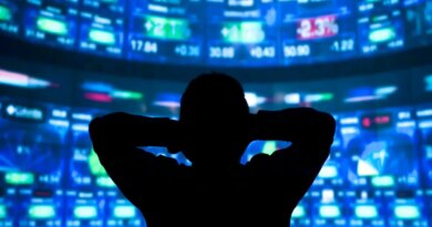 young man standing in front of the projection reflected stock market
