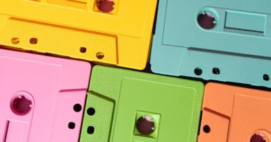 Vibrant cassette tapes in yellow, pink, green, blue, and orange