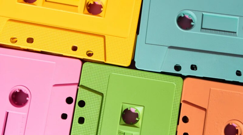 Vibrant cassette tapes in yellow, pink, green, blue, and orange