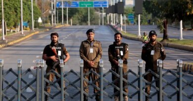Police officers stand guard behind a barricade near Serena Hotel, as Pakistan prepares to host the U.S. and Iran for the second round of peace talks, in Islamabad, Pakistan, April 25, 2026. REUTERS/Asim Hafeez