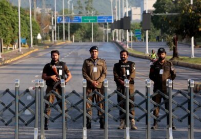 Police officers stand guard behind a barricade near Serena Hotel, as Pakistan prepares to host the U.S. and Iran for the second round of peace talks, in Islamabad, Pakistan, April 25, 2026. REUTERS/Asim Hafeez