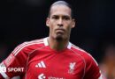 Liverpool captain Virgil van Dijk looks on as he stands with his hands resting on his hips after Liverpool's FA Cup defeat by Manchester City 