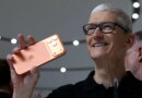 Apple CEO Tim Cook holds up a new iPhone 17 Pro