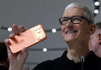 Apple CEO Tim Cook holds up a new iPhone 17 Pro