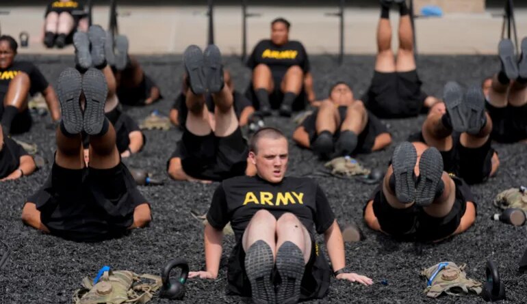 soldiers exrcise in black shirts reading 'ARMY'