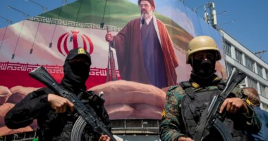 TEHRAN, IRAN - APRIL 9: Members of the Iranian security forces stand guard under a large portrait of Iran's new Supreme Leader, Mojtaba Khamenei, during a memorial to mark the 40th day since his father, Ali Ayatollah Khamenei, was killed in US-Israeli joint strikes, on April 9, 2026 in Tehran, Iran. On April 8 President Donald Trump announced a two-week ceasefire between the US and Iran, conditional on shipping being allowed to resume through the Strait of Hormuz. (Photo by Majid Saeedi/Getty Images)