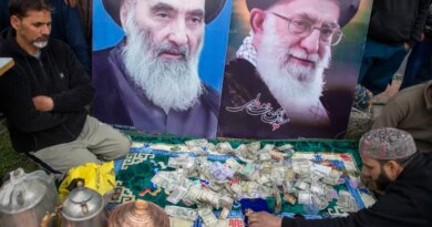 Cash donated for Iran at a collection drive in Indian-administered Kashmir [Junaid Bhat/ Al Jazeera]