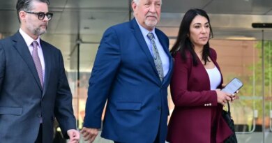 Mark Geragos and Alexandra Kazarian, attorneys for Jasveen Sangha, walk outside the First Street Courthouse in Los Angeles on April 8, 2026.