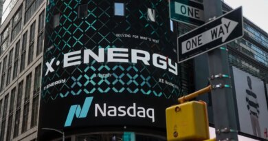 X-energy appears on a sign above the Nasdaq.
