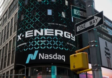 X-energy appears on a sign above the Nasdaq.