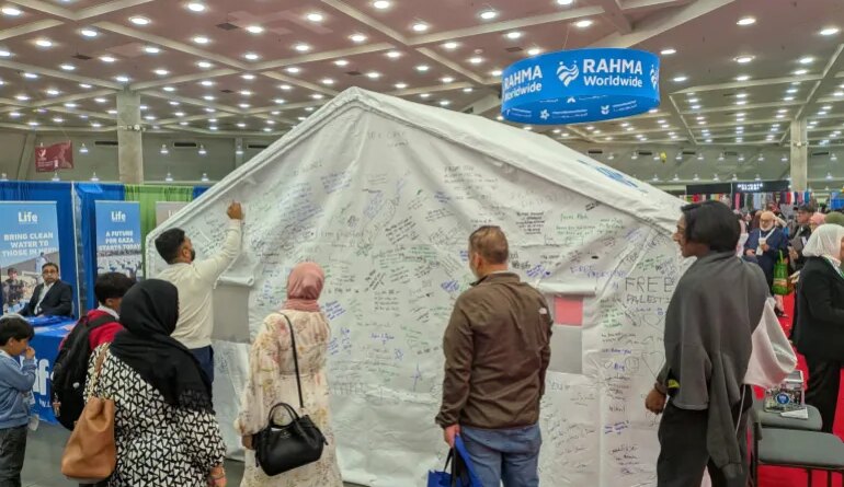 People sign tent
