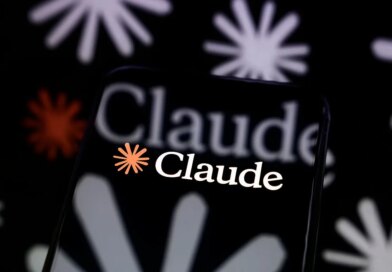The Claude logo is displayed on a smartphone screen placed on a reflective surface onto which a multitude of Claude logos are projected.