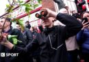 A fan is seen using binoculars outside the stadium prior to the Championship play-off semi-final match between Middlesbrough and Southampton at Riverside Stadium