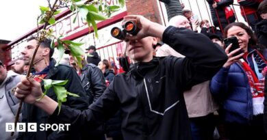 A fan is seen using binoculars outside the stadium prior to the Championship play-off semi-final match between Middlesbrough and Southampton at Riverside Stadium