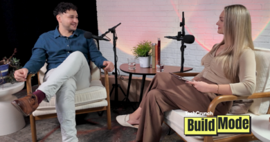 Two people seated in armchairs during a podcast interview, speaking into microphones across a small table with water glasses and a plant, with a “TechCrunch Build Mode” logo overlay in the corner.