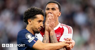 Paris St-Germain captain Marquinhos hugs his Brazilian team-mate Gabriel after the Arsenal defender missed a decisive penalty in their Champions League final shootout.