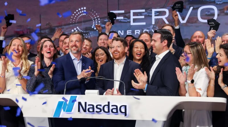 People applauding a new stock listing on the Nasdaq.