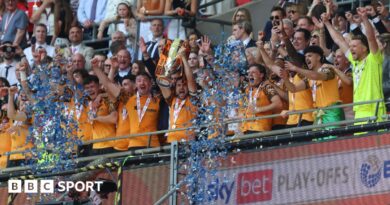 Hull players lift the trophy after winning the Championship play-offs at Wembley