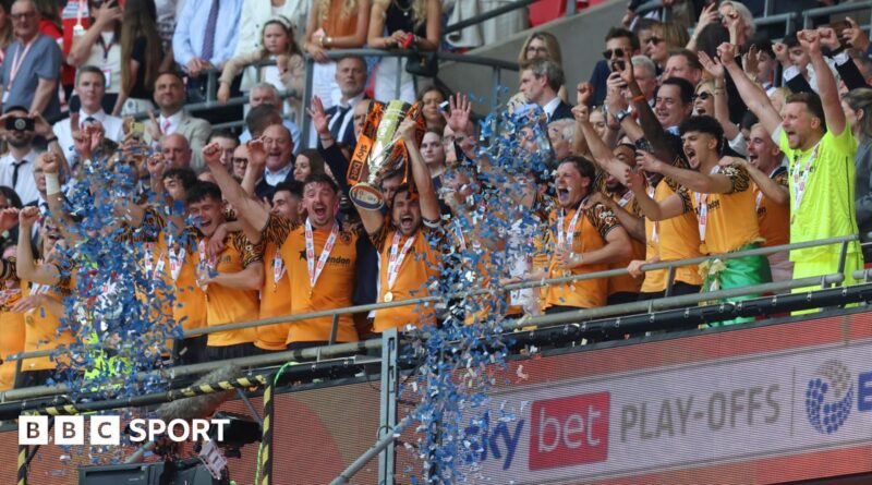 Hull players lift the trophy after winning the Championship play-offs at Wembley
