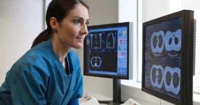 Doctor looking at x-rays from CT-scanner on computer
