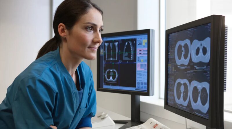 Doctor looking at x-rays from CT-scanner on computer