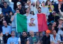 Fans of Jannik Sinner, of Italy, hold an Italian flag with his picture during his final match against Casper Ruud, of Norway, at the Italian Open tennis tournament, in Rome, Sunday, May 17, 2026. (AP Photo/Alessandra Tarantino)
