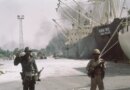 Iraqi forward troops stand guard over shipping at the dockside in occupied Khorramshahr, Iran on Oct. 7, 1980. (AP Photo)