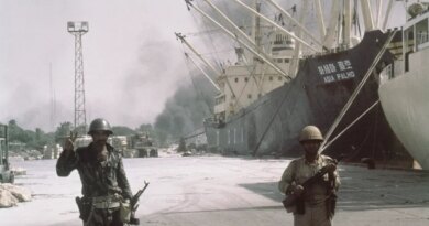 Iraqi forward troops stand guard over shipping at the dockside in occupied Khorramshahr, Iran on Oct. 7, 1980. (AP Photo)