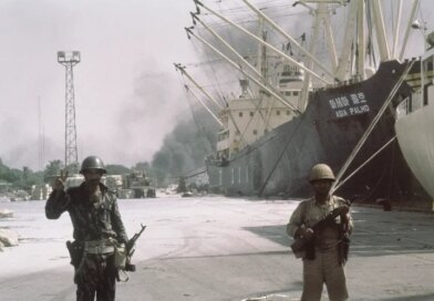 Iraqi forward troops stand guard over shipping at the dockside in occupied Khorramshahr, Iran on Oct. 7, 1980. (AP Photo)