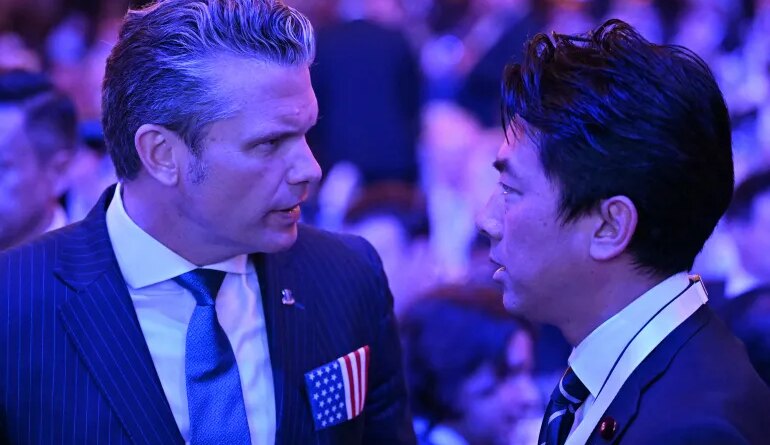 US Secretary of Defense Pete Hegseth (L) speaks with Japan's Defense Minister Shinjiro Koizumi during the 23rd Shangri-La Dialogue summit in Singapore on May 29, 2026. (Photo by JAM STA ROSA / AFP)