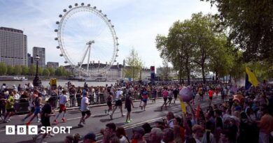 London Marathon runners with the London Eye in the background