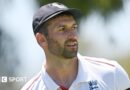Mark Wood, wearing a blue England cap, looks to the side