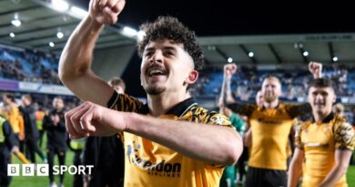 Hull City winger Mohamed Belloumi celebrates in front of his team-mates after their 2-0 win at Millwall