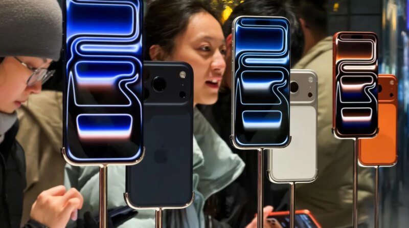 Customers try out iPhone 17 Pro smartphones inside the Apple Store at Sanlitun Taikoo Li on November 8, 2025, in Beijing, China.