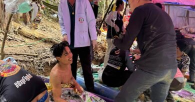 Rescuers free four more men from flooded Laos cave, two still missing