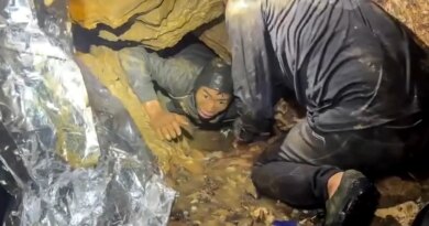 Rescuers race to save two people still trapped in cave in Laos
