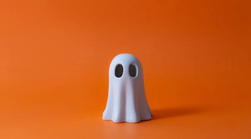 Cute Halloween Ghost over orange background.