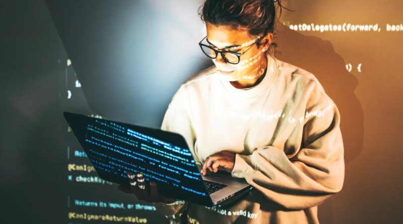 Young woman programming.