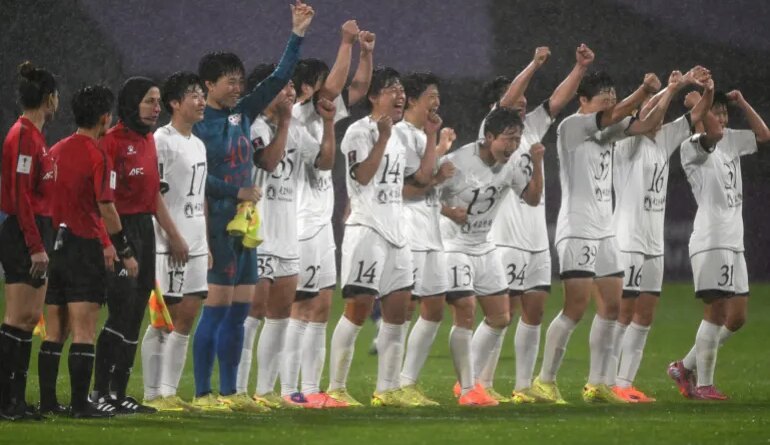 Naegohyang Women's FC players celebrate their victory after the AFC Women's Champions League semi-final football match between North Korea's Naegohyang Women's FC and South Korea's Suwon FC Women in Suwon on May 20, 2026. (Photo by Jung Yeon-je / AFP)
